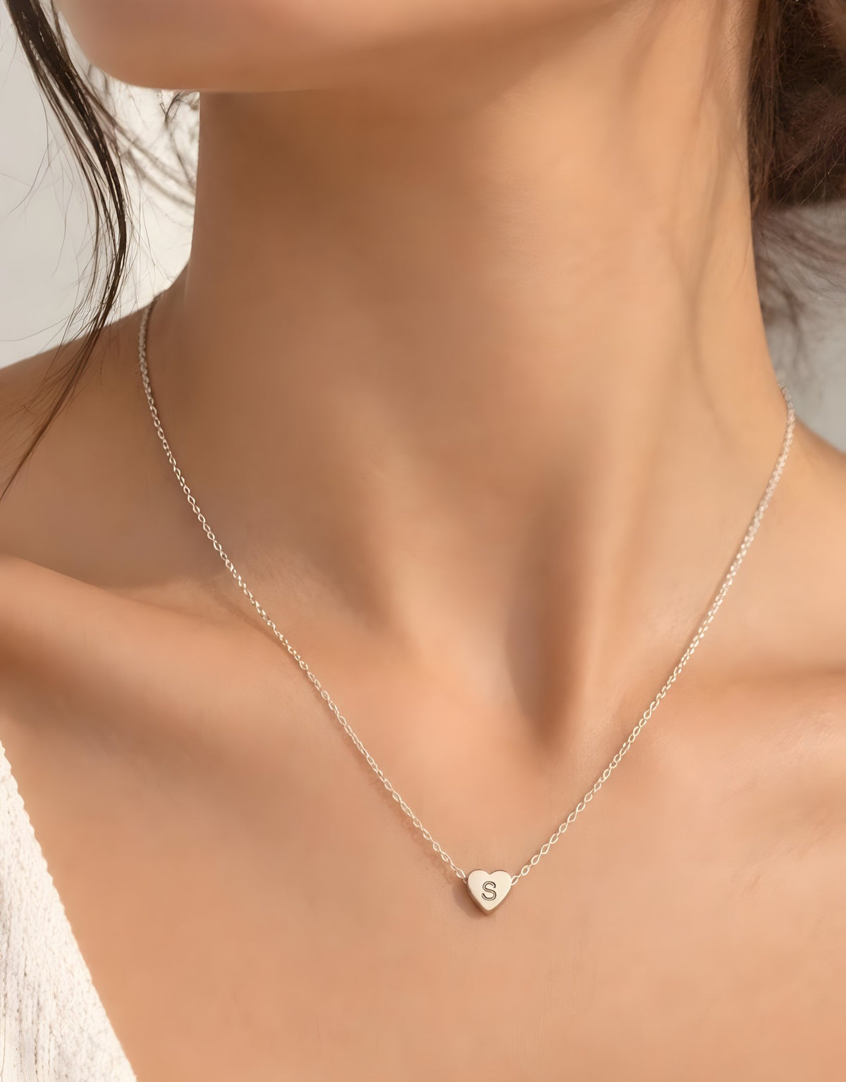 Dainty heart initial necklace worn